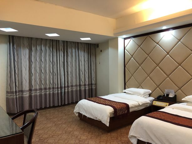 Imagen de la habitación del Hotel Puqian Business. Foto 6