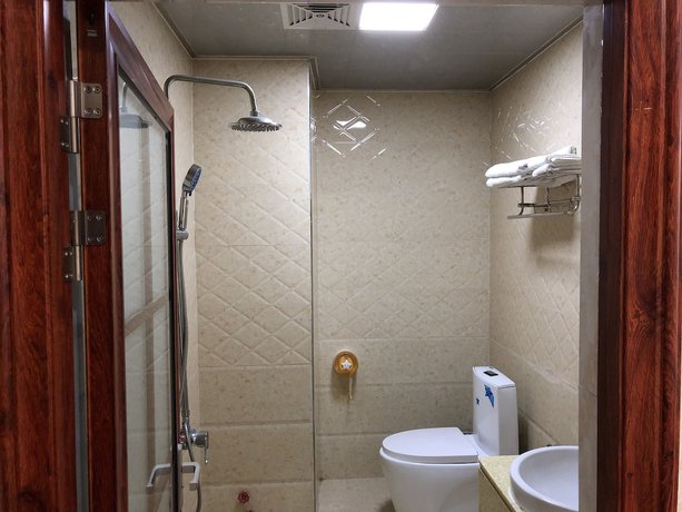 Imagen de la habitación del Hotel Puqian Business. Foto 7