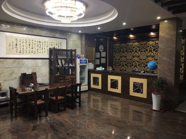 Imagen de los interiores del Hotel Puqian Business. Foto 14