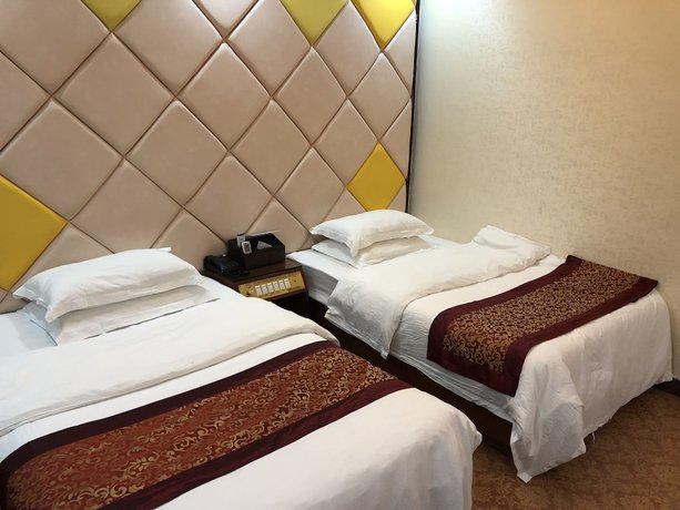 Imagen de la habitación del Hotel Puqian Business. Foto 10