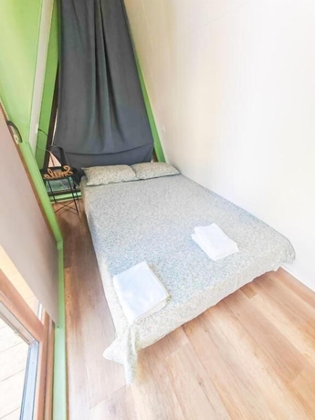 Imagen de la habitación del Hotel Pura Vida Downtown Tiny Houses. Foto 11