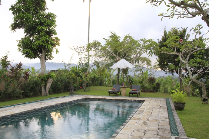 Imagen de la piscina del Hotel Puri Bagus Manggis. Foto 15