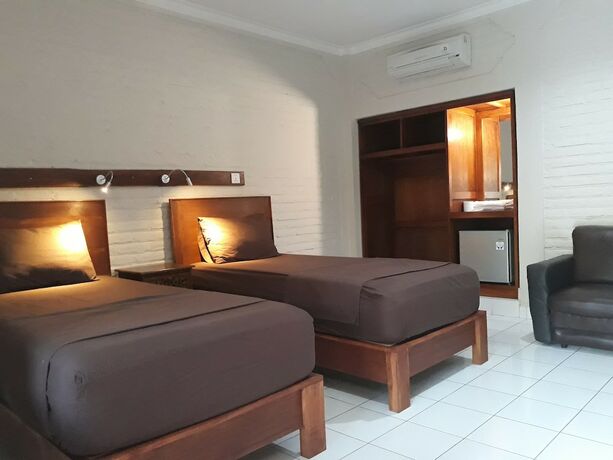Imagen de la habitación del Hotel Puri Bali. Foto 19