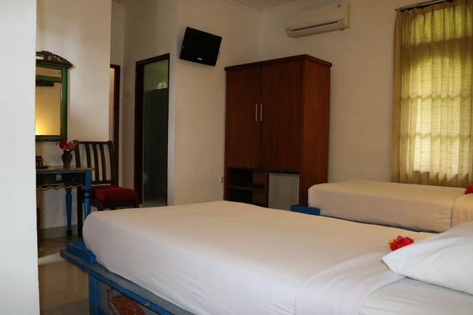 Imagen de la habitación del Hotel Puri Bunga Senggigi. Foto 5