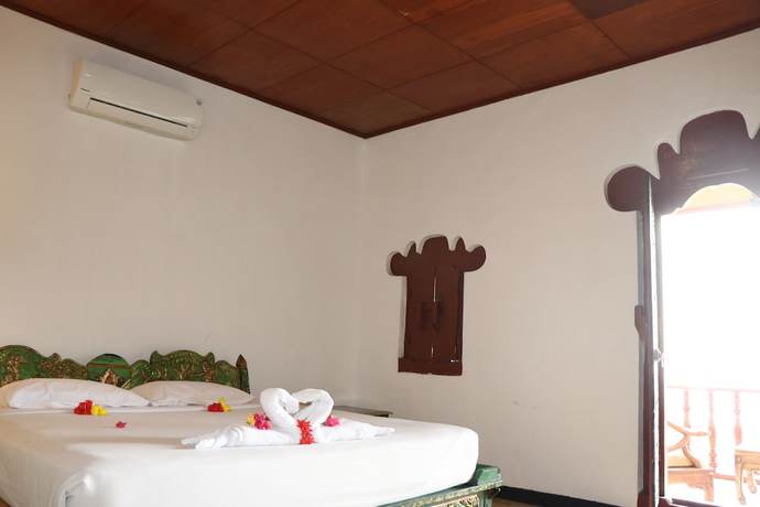 Imagen de la habitación del Hotel Puri Bunga Senggigi. Foto 10