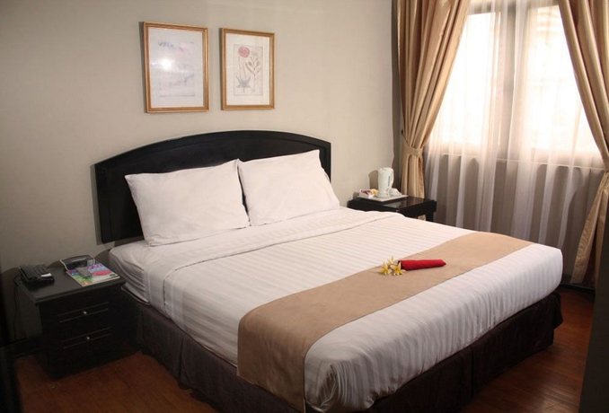 Imagen de la habitación del Hotel Puri Denpasar. Foto 5