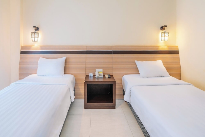 Imagen de la habitación del Hotel Puri Indah Subak. Foto 7