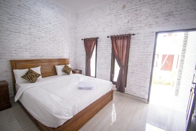 Imagen de la habitación del Hotel Puri Ratu Nusa Penida. Foto 12