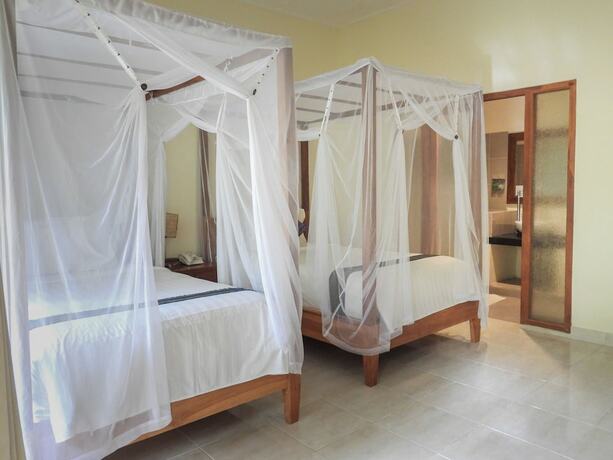 Imagen de la habitación del Hotel Puri Sari Beach. Foto 16