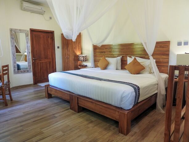 Imagen de la habitación del Hotel Puri Sari Beach. Foto 18