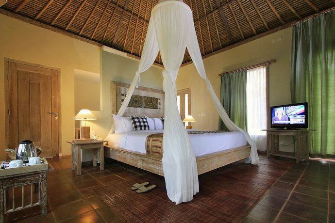 Imagen de la habitación del Hotel Puri Sebatu Resort. Foto 11