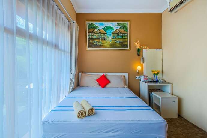 Imagen de la habitación del Hotel Puri Singgasana Ambarukmo. Foto 7