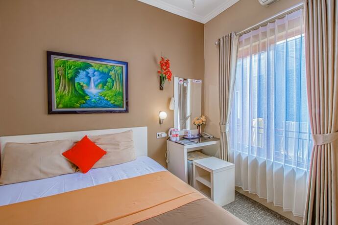 Imagen de la habitación del Hotel Puri Singgasana Ambarukmo. Foto 11