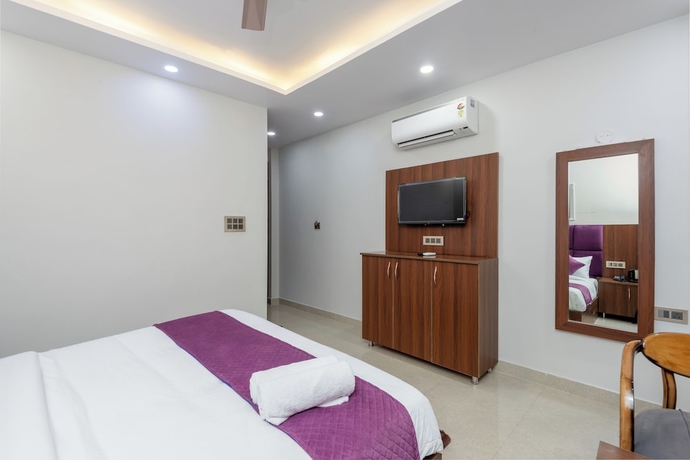Imagen de la habitación del Hotel Purple Dot Haridwar. Foto 9