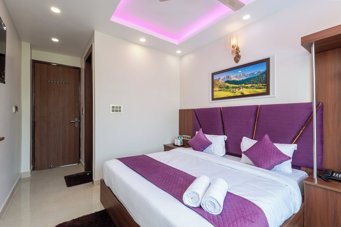 Imagen de la habitación del Hotel Purple Dot Haridwar. Foto 10