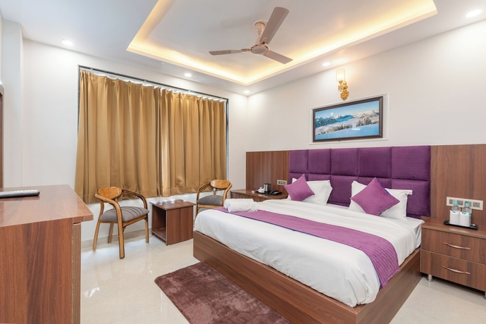 Imagen de la habitación del Hotel Purple Dot Haridwar. Foto 11