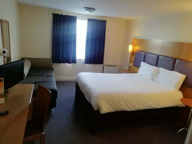 Imagen de la habitación del Hotel Purple Roomz. Foto 13