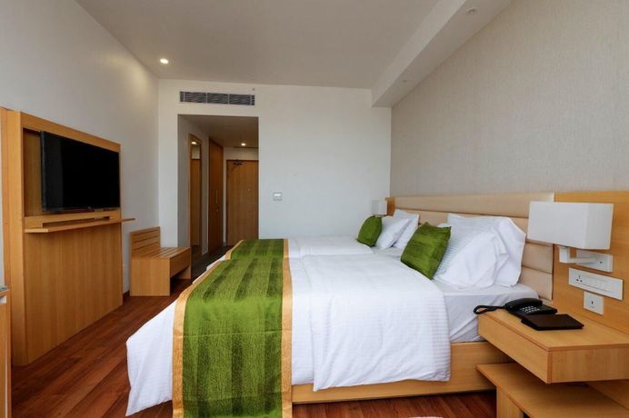 Imagen de la habitación del Hotel Pushkara Sarovar Portico Dibrugarh. Foto 5