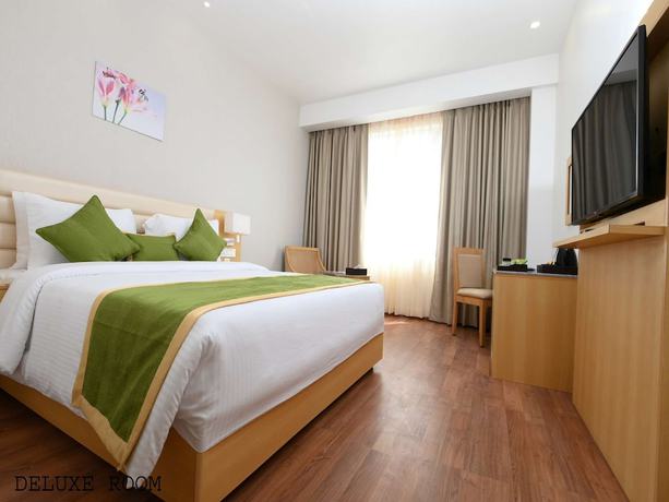 Imagen de la habitación del Hotel Pushkara Sarovar Portico Dibrugarh. Foto 8