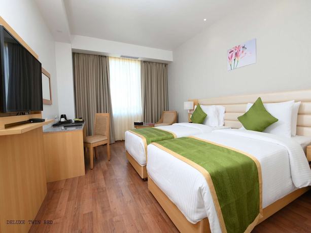 Imagen de la habitación del Hotel Pushkara Sarovar Portico Dibrugarh. Foto 9