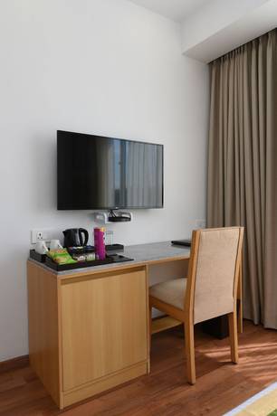 Imagen de la habitación del Hotel Pushkara Sarovar Portico Dibrugarh. Foto 15