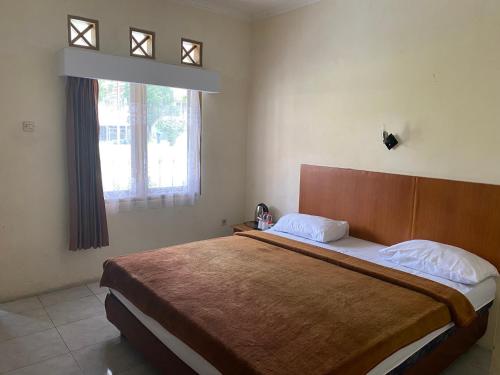 Imagen de la habitación del Hotel Puspa Sari. Foto 17