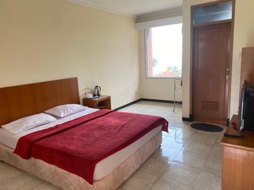 Imagen de la habitación del Hotel Puspa Sari. Foto 18