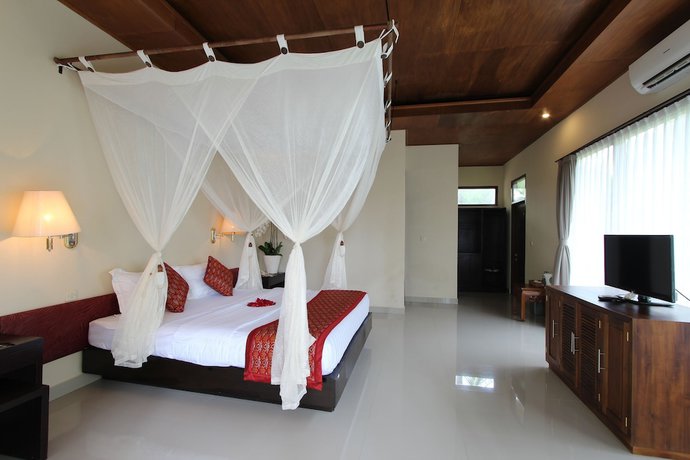Imagen de la habitación del Hotel Putri Ayu Cottages. Foto 3
