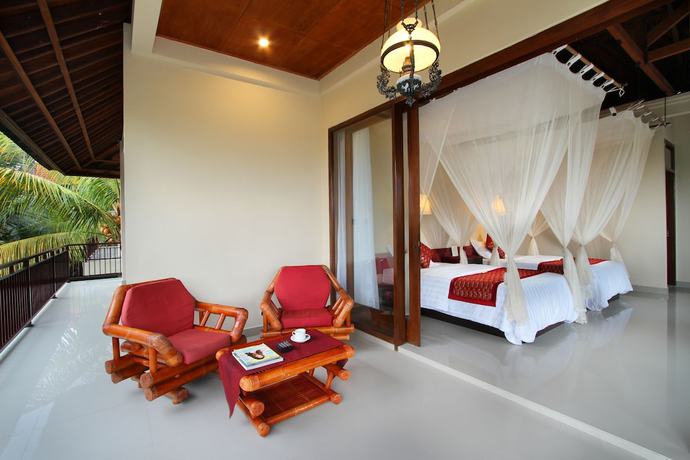 Imagen de la habitación del Hotel Putri Ayu Cottages. Foto 7