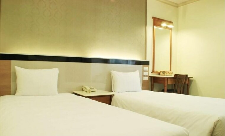 Imagen de la habitación del Hotel Puyisy Business. Foto 17