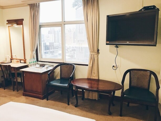 Imagen de la habitación del Hotel Puyisy Business. Foto 18