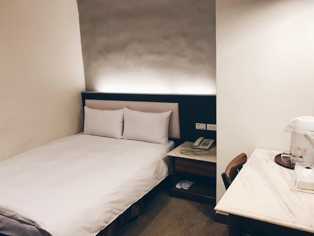 Imagen de la habitación del Hotel Puyisy Business. Foto 26