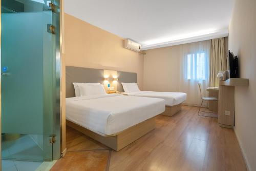 Imagen de la habitación del Hotel Puyou. Foto 18
