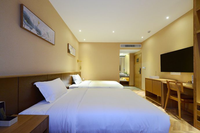 Imagen de la habitación del Hotel Puzhehei Xiyard Resort. Foto 2