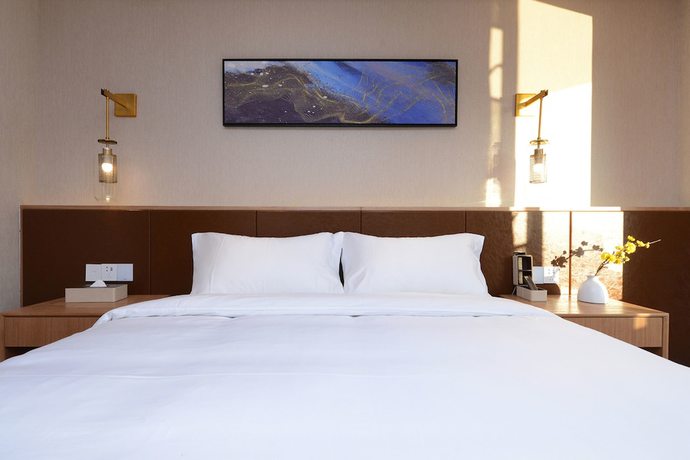 Imagen de la habitación del Hotel Puzhehei Xiyard Resort. Foto 3