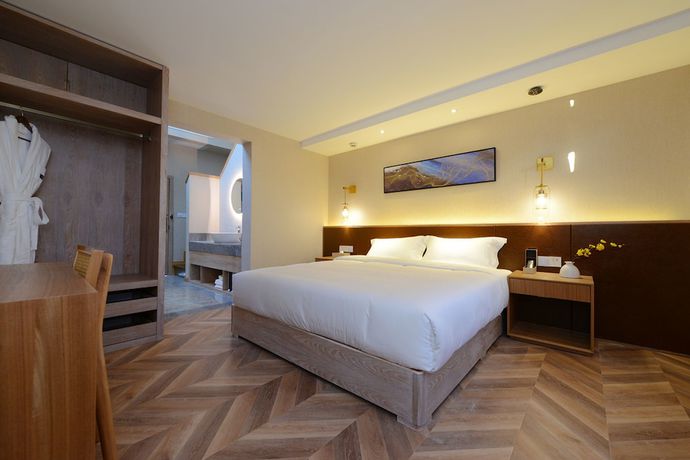 Imagen de la habitación del Hotel Puzhehei Xiyard Resort. Foto 4