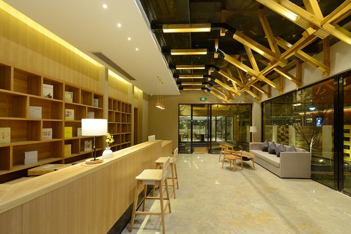 Imagen de los interiores del Hotel Puzhehei Xiyard Resort. Foto 18