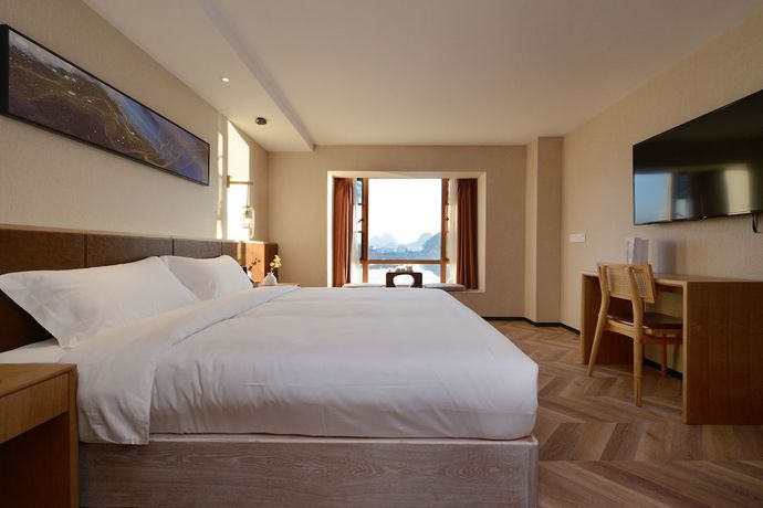 Imagen de la habitación del Hotel Puzhehei Xiyard Resort. Foto 7