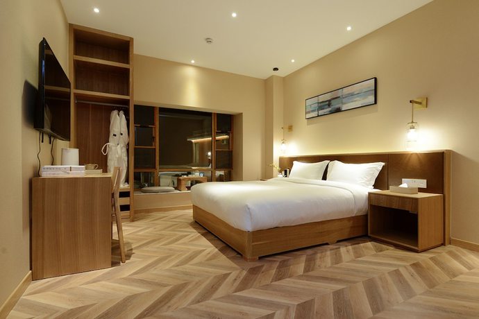 Imagen de la habitación del Hotel Puzhehei Xiyard Resort. Foto 8