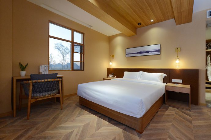 Imagen de la habitación del Hotel Puzhehei Xiyard Resort. Foto 9