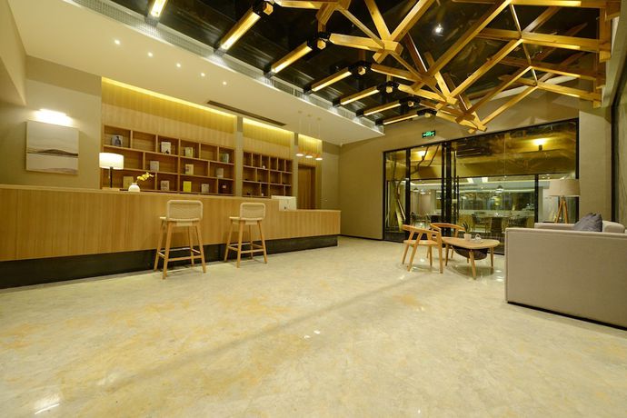 Imagen de los interiores del Hotel Puzhehei Xiyard Resort. Foto 19