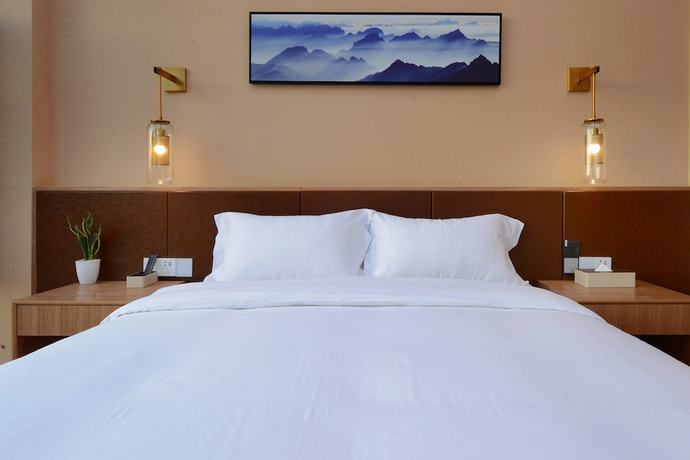 Imagen de la habitación del Hotel Puzhehei Xiyard Resort. Foto 10