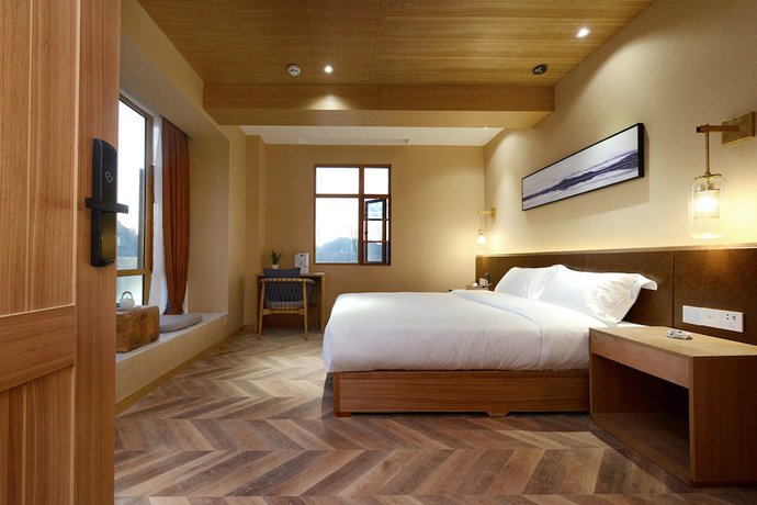 Imagen de la habitación del Hotel Puzhehei Xiyard Resort. Foto 11