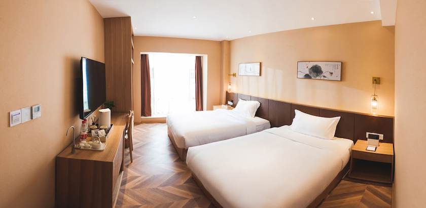 Imagen de la habitación del Hotel Puzhehei Xiyard Resort. Foto 12