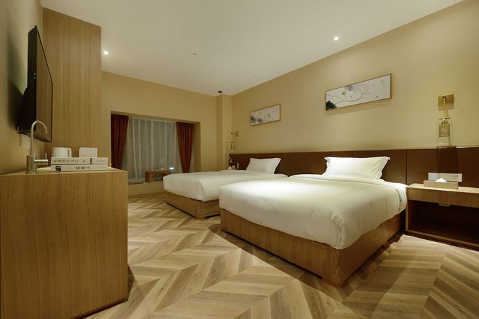 Imagen de la habitación del Hotel Puzhehei Xiyard Resort. Foto 14