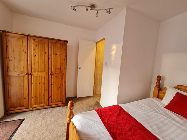 Imagen de la habitación del Hotel Pymgate Lodge. Foto 16