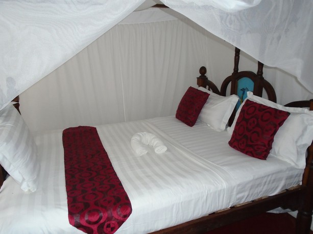 Imagen de la habitación del Hotel Pyramid Zanzibar. Foto 18