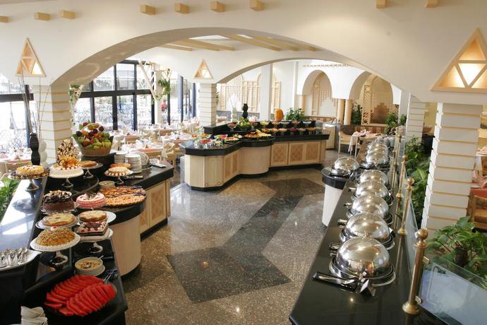 Imagen del bar/restaurante del Hotel Pyramids Resort By Jaz. Foto 7