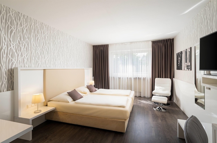Imagen de la habitación del Hotel QU Augsburg. Foto 2