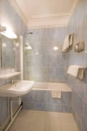Imagen de la habitación del Hotel QUAI VOLTAIRE. Foto 7